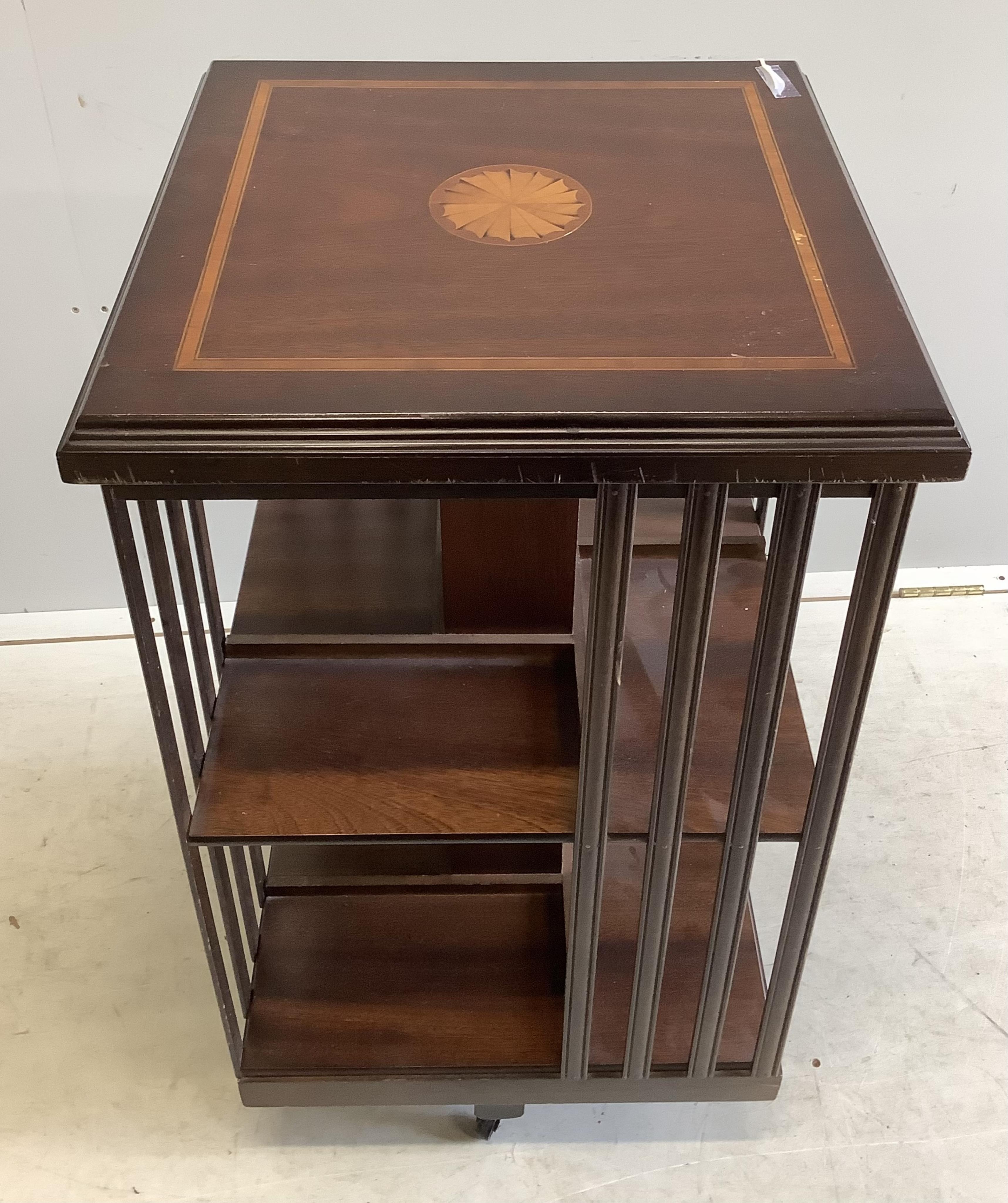 An Edwardian style inlaid mahogany revolving bookcase, width 47cm, depth 47cm, height 85cm. Condition - fair to good